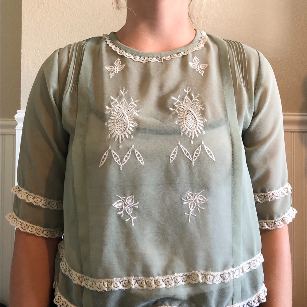 Semi-sheer light green shirt